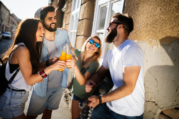 Group of young friends having fun together outdoor