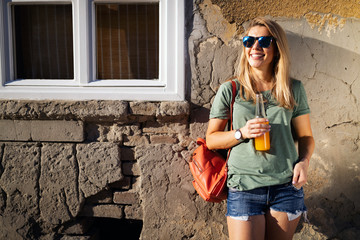 Urban lifestyle, hipster beautiful woman having fun on the street