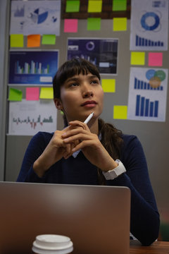 Thoughtful businesswoman siting in office 