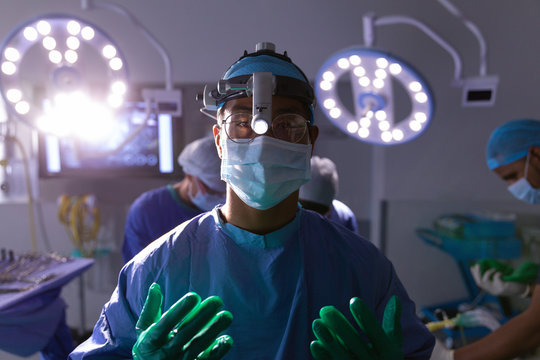 Surgeon in personal protective equipment in operating room