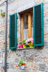 Fototapeta na wymiar Residential house Window with flowers