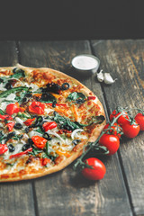 Delicious fresh pizza served on wooden table