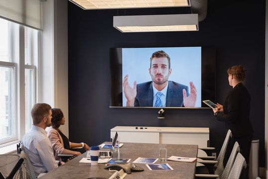 Business executives doing video conferencing in business meeting 
