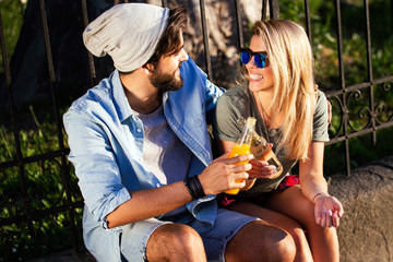 Fototapeta premium Cheerful couple dating, smiling and talking on summer day
