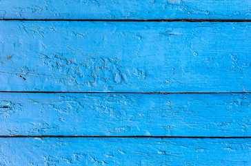 Fototapeta na wymiar Old grunge background of weathered painted blue wooden plank. Vertical, copy space. Horizontal.