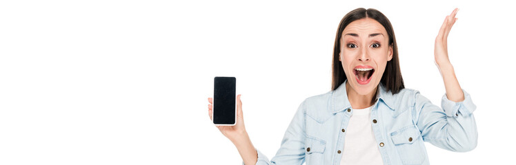 excited young woman showing smartphone with blank screen isolated on white, panoramic shot