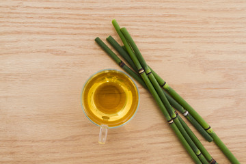 Top view cup of tea with bamboo