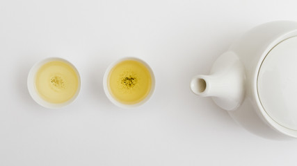 Obraz na płótnie Canvas Top view teacup with teapot