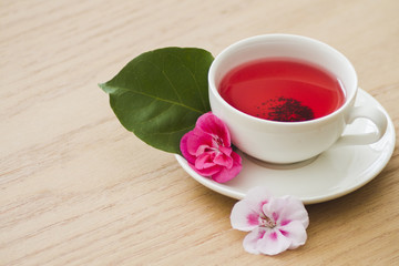 Fototapeta na wymiar Cup of tea with flowers
