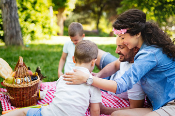 Young family with children having fun in nature