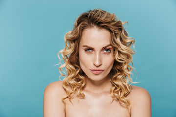 Beauty image of glamorous half-naked woman posing at camera with seductive look