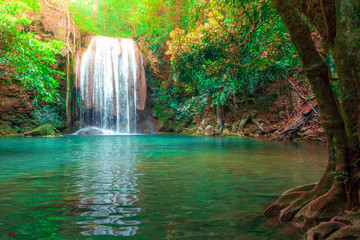 Hot Springs Onsen Natural Bath Surrounded by red-yellow leaves.Waterfalls in the emerald blue water in Erawan National Park.beautiful natural rock waterfall in Kanchanaburi, Thailand.