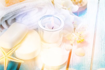 Obraz na płótnie Canvas Healthy spa concept with handmade soap bars, oil bottles, towel,candle