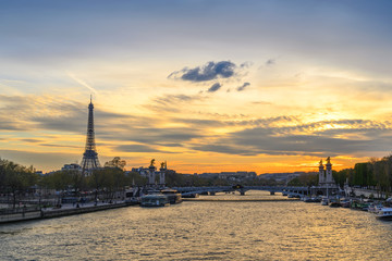 Paris France city skyline sunset at Seine River with Pont Alexandre III bridge and Eiffel Tower
