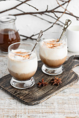 Cold iced coffee with vanilla ice cream and cinnamon