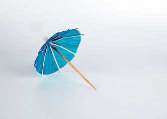 Cocktail umbrella on a white background