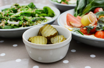 Tangy gherkin slices and fresh summer salads