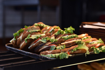 many ready cheeseburgers in fast food restaurant
