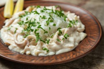 Squid in sour cream sauce. Greek national dish