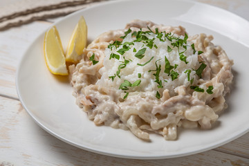 Squid in sour cream sauce. Greek national dish