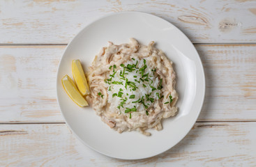 Squid in sour cream sauce. Greek national dish. The view from the top. Copy-space.