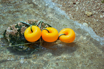 Naklejka premium Orange buoy gray Keep available safety float marker