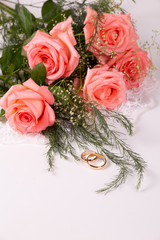 Wedding conceptith beautiful roses and two wedding rings