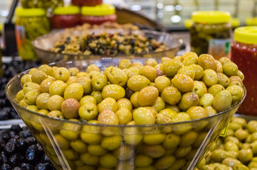 Fresh green olives for sale at local market