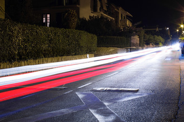 Tracers from passing cars. Night road with ghosts of cars lights. Long exposure.