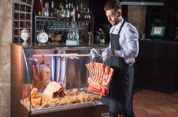 Display of Dry Aged Meat Steaks in butchers shop or restaurant in an display refrigerator.