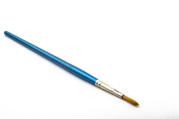 Old used watercolor paintbrush on white background