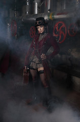 Attractive steampunk woman with suitcase