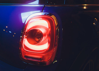 Close up projector Taillight of the modern and elegant car, automotive part concept.