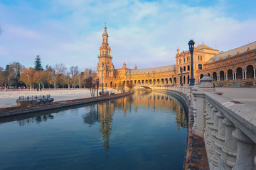 Naklejka premium Canal Promenade Around Famous Landmark - The Plaza De Espana In Seville, Andalusia, Spain