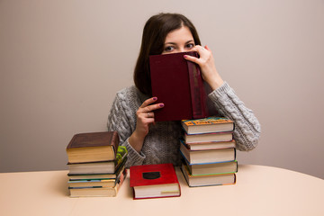 Student girl with stack of books 