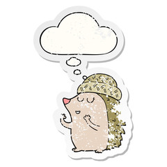 cartoon hedgehog wearing hat and thought bubble as a distressed worn sticker