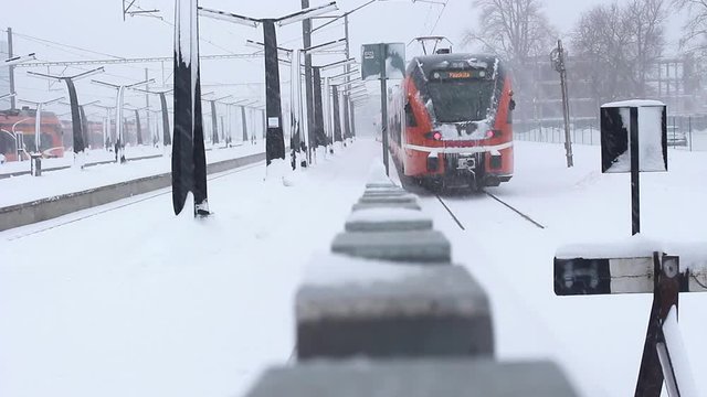train leaving in snowy station