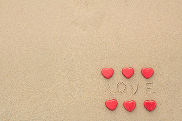 Chocolate color Lovely red heart on the beach. Background is a natural in real place, creative Valentine's Day Concept, tropical style background made in Phuket, Thailand.