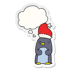 cute christmas penguin and thought bubble as a printed sticker