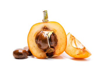 Fresh loquats freshly picked in an organic cultivation, photographed on a white background. Natural and healthy fruit.
