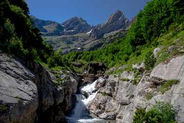 Fototapeta na wymiar Cinca waterfalls in National Park of Ordesa and Monte Perdido. Valley of Pineta, Bielsa, Spain.