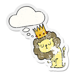 cartoon lion with crown and thought bubble as a distressed worn sticker