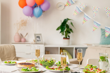 Served homemade food and flutes with champagne