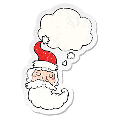 cartoon santa face and thought bubble as a distressed worn sticker