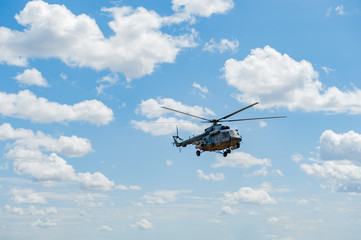 Fototapeta na wymiar Flying military transport helicopter special for army soldier in fight war. Military soldier volant in transport helicopter above clean blue sky. Helicopter is military transport to army soldier