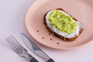 Healthy avocado toast for breakfast or lunch with rye bread and avocado. Vegetarian sandwiches. Herbal diet. Whole food concept.