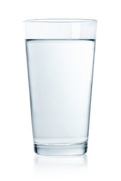 Glass of still water on white background