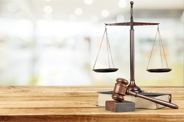 Justice Scales and books and wooden gavel on table. Justice concept