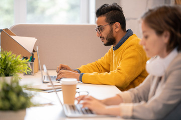 Man preparing presentation on laptop