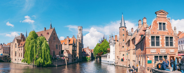 Fototapeta premium Panoramic city view with Belfry tower and famous canal in Bruges, Belgium.